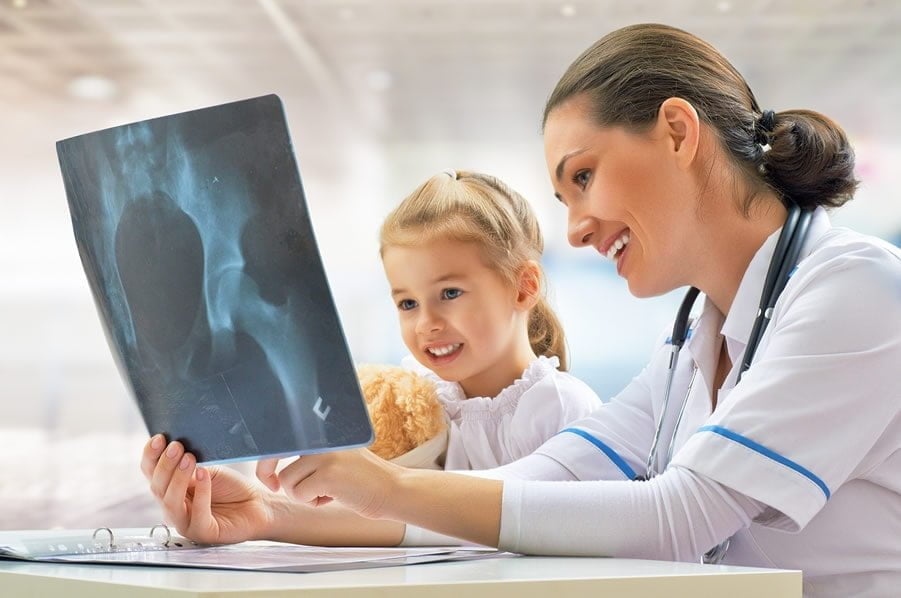 Best Doctors - Doctor showing a little girl an x-ray